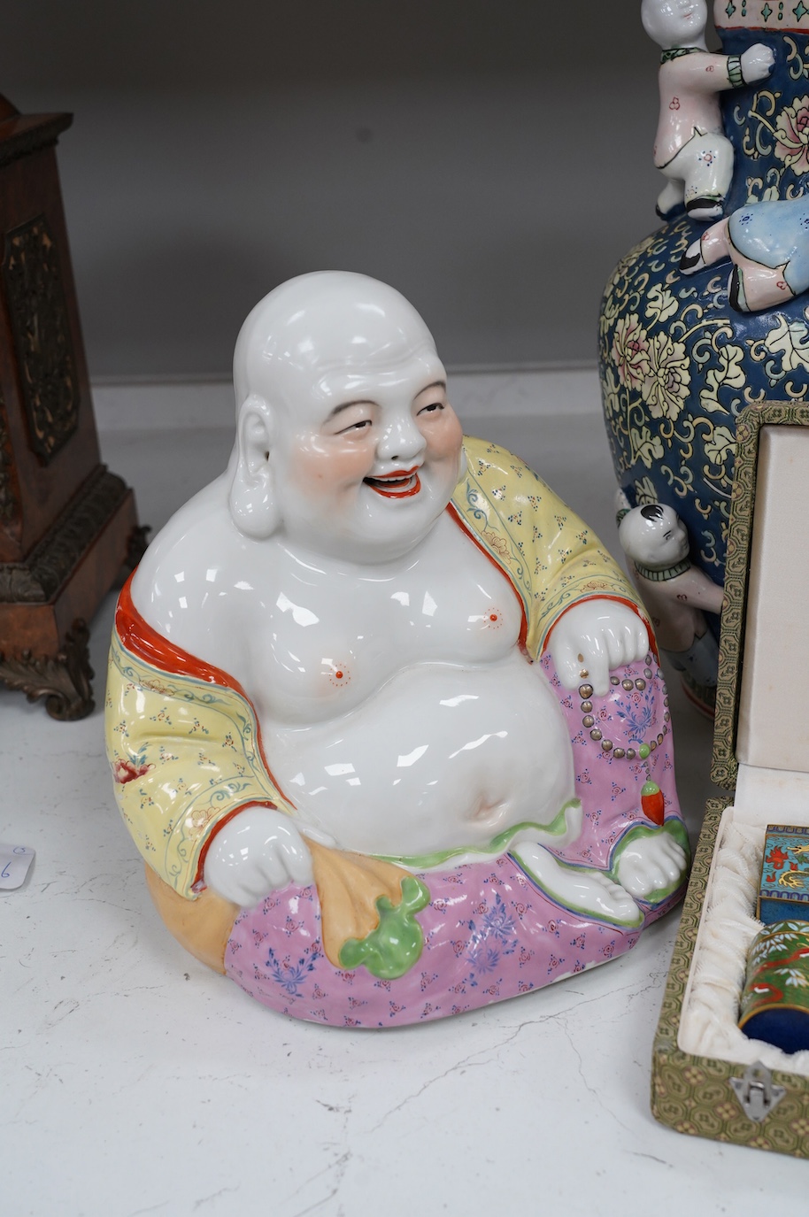 A 20th century Chinese famille rose Buddha, a ‘hundred boys’ vase and a boxed set of cloisonné boxes, vase 34cm. Condition - cloisonné boxes good, Buddha has missing decoration to robe near right hand and vase good